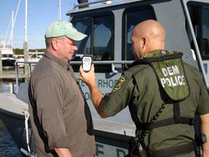 dem police showing a handheld item to another man