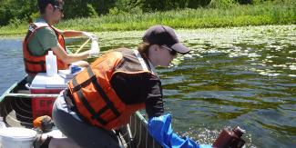 RIDEM staff collect samples to test lake water quality