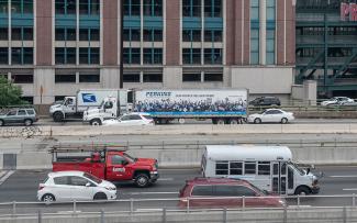 Passanger vehicles traveling on Interstate 95 in downtown Providence