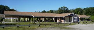 The open air Great Swamp Shooting Range  building with the range behind