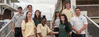 Seasonal staff stand on the steps at Roger Wheeler State Beach in Narragansett